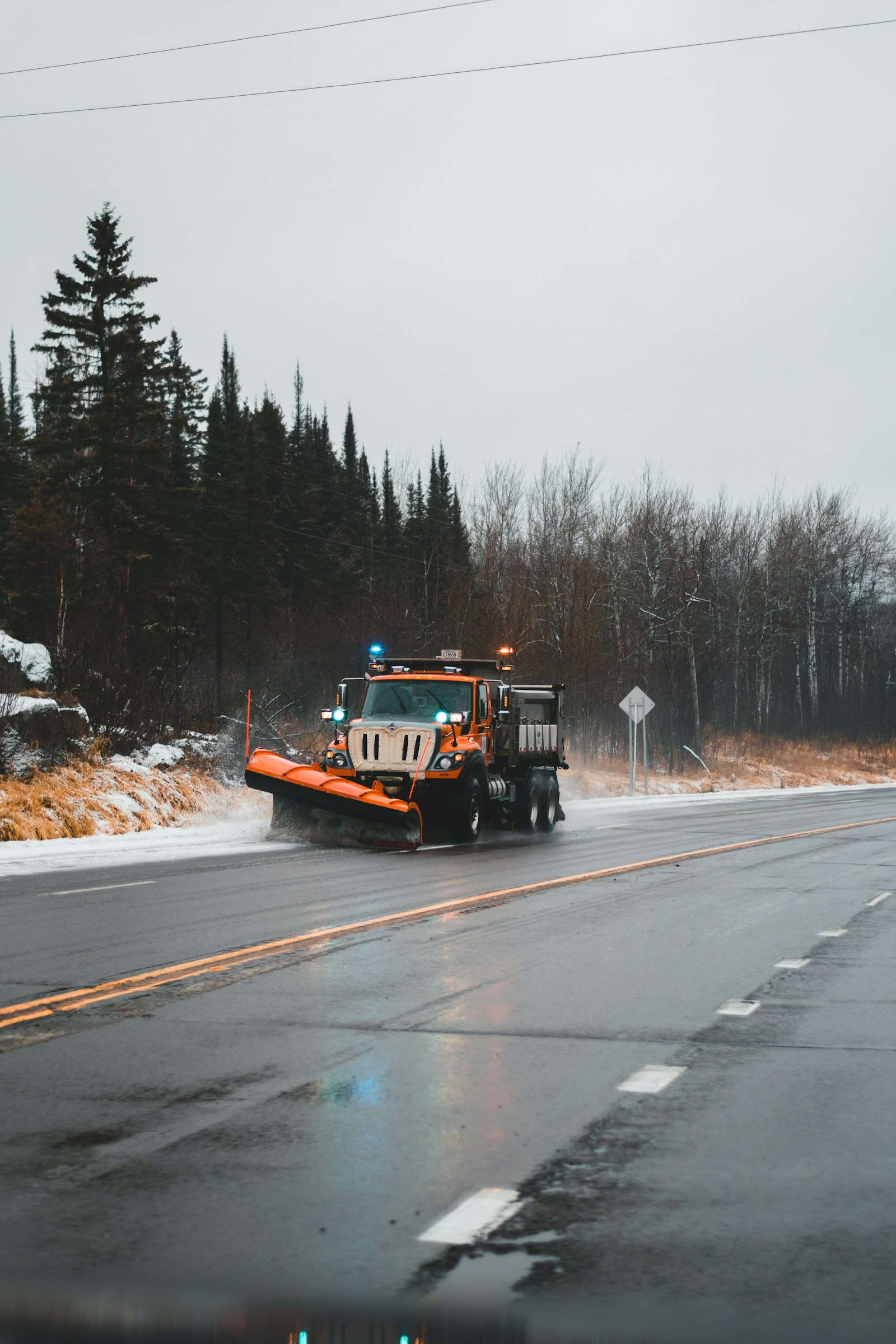 Snow plow clearing a road during winter maintenance